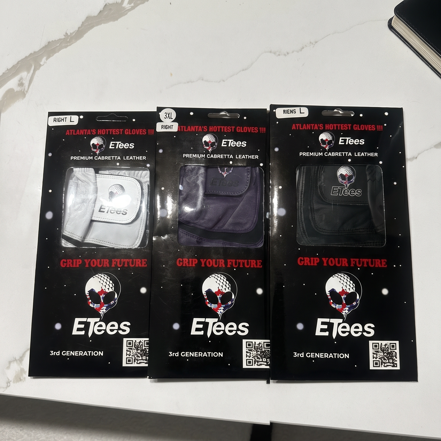 Three packaged Efees leather accessories displayed on a light marble surface, with promotional text below reading 'THE CONSISTENT, PREMIUM FEEL YOU CRAVE' and 'AUTHENTIC CABRETTA LEATHER | $24.99'.